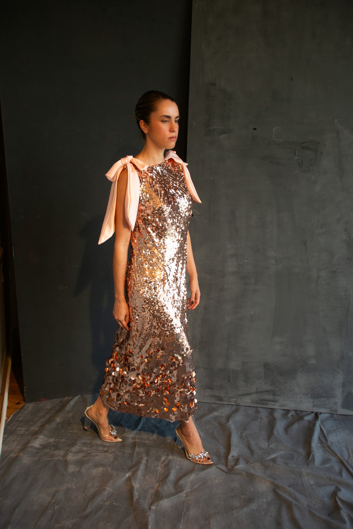Eos rose-gold sequin bow gown by Calliope Anemouli