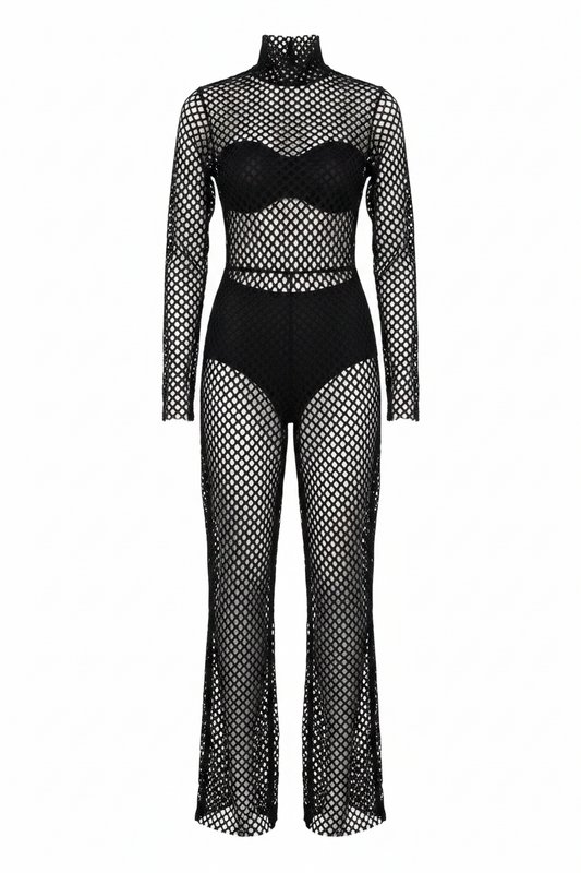 Person wearing a black fishnet outfit against a gray background