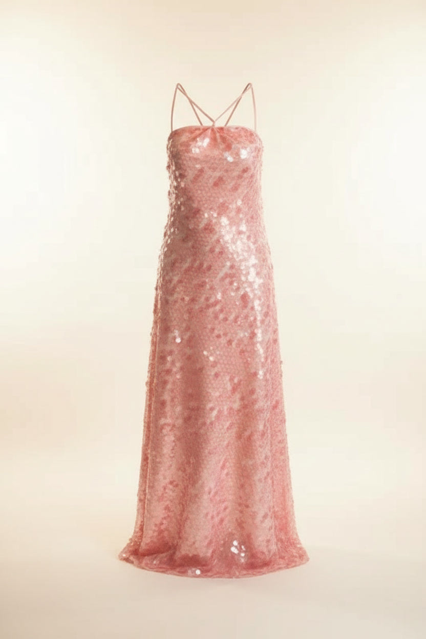 Pink sequin dress on a beige background