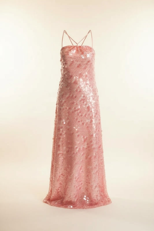 Pink sequin dress on a beige background