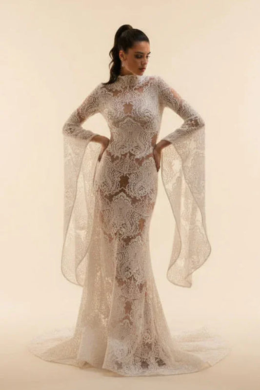 Woman wearing a elegant white lace dress against a beige background