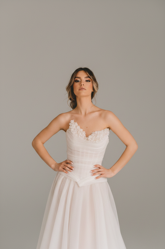 Woman in a white wedding dress standing on a staircase